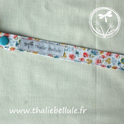 Attache tétine bleu à motifs de couleurs en tissu coton